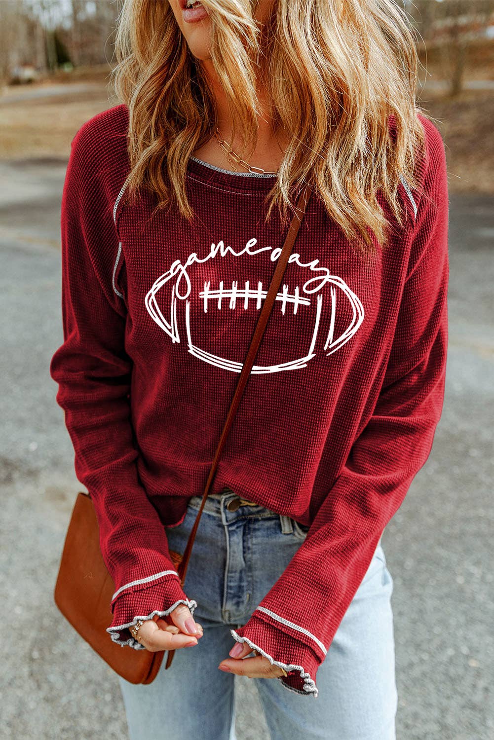 Red Game day waffle knit long sleeve top styled for game day with casual bottoms and accessories.