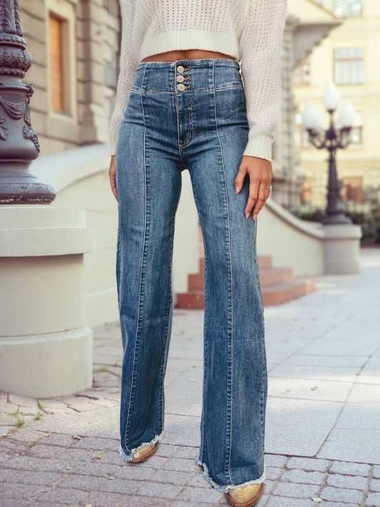 Canyon High-rise flare jeans with button fly and raw hem, styled with boots and a tucked sweater.