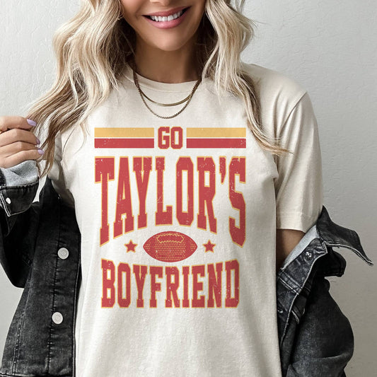 Swiftie-inspired game day go Taylors boyfriend tee with bold text, styled with sneakers and denim.